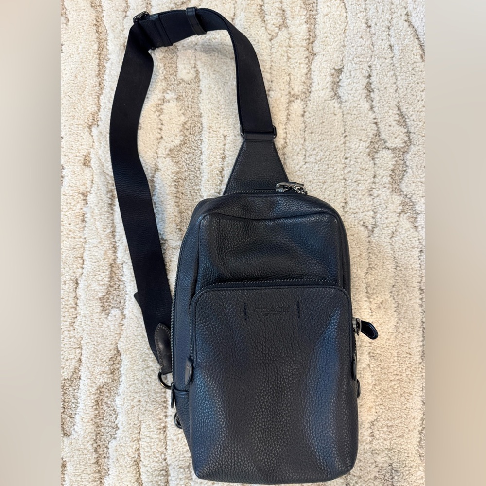 Coach Gotham Leather Sling Pack. Great condition. Used once. Dust bag.